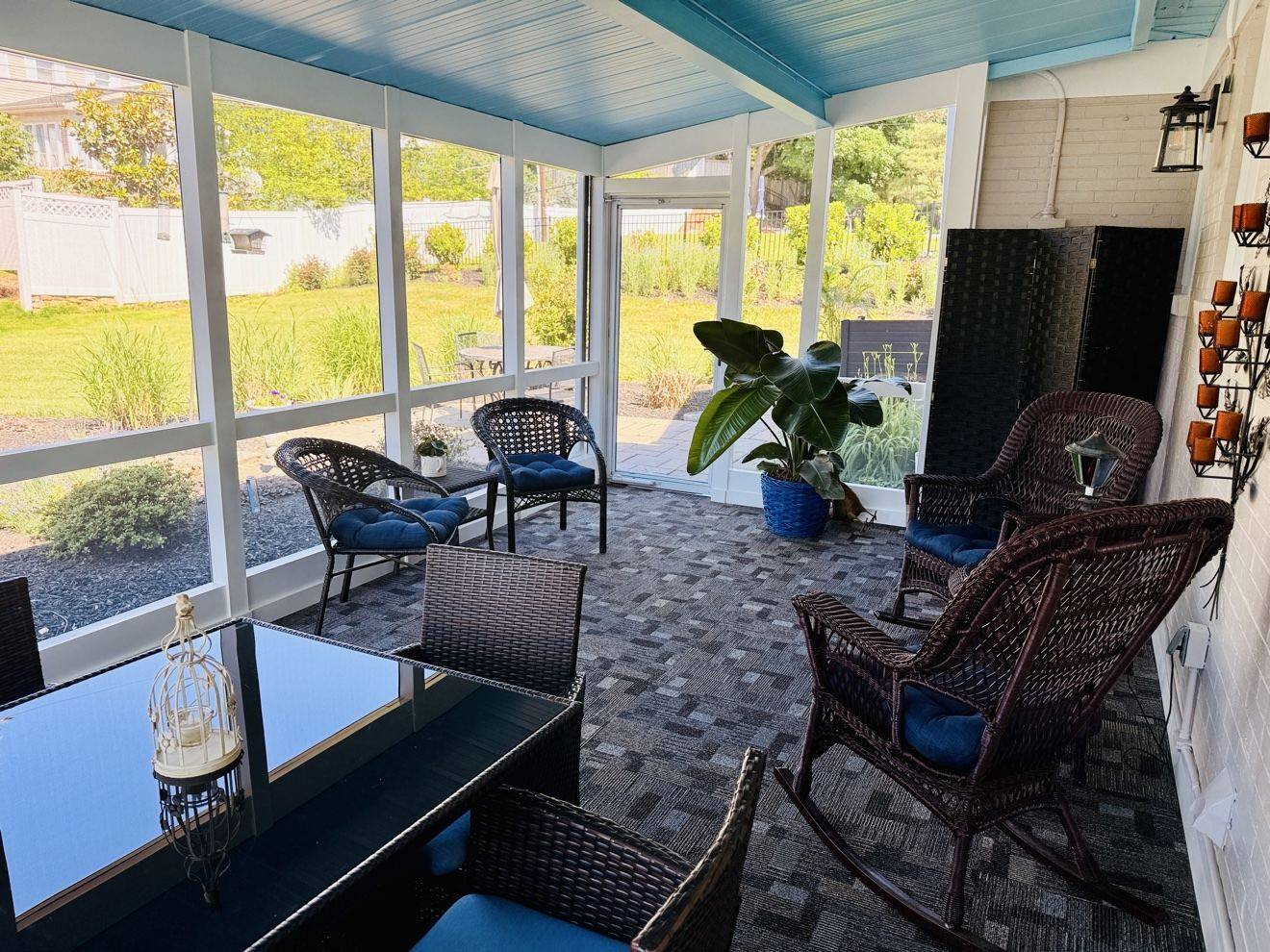 Freshly cleaned screened porch with seating