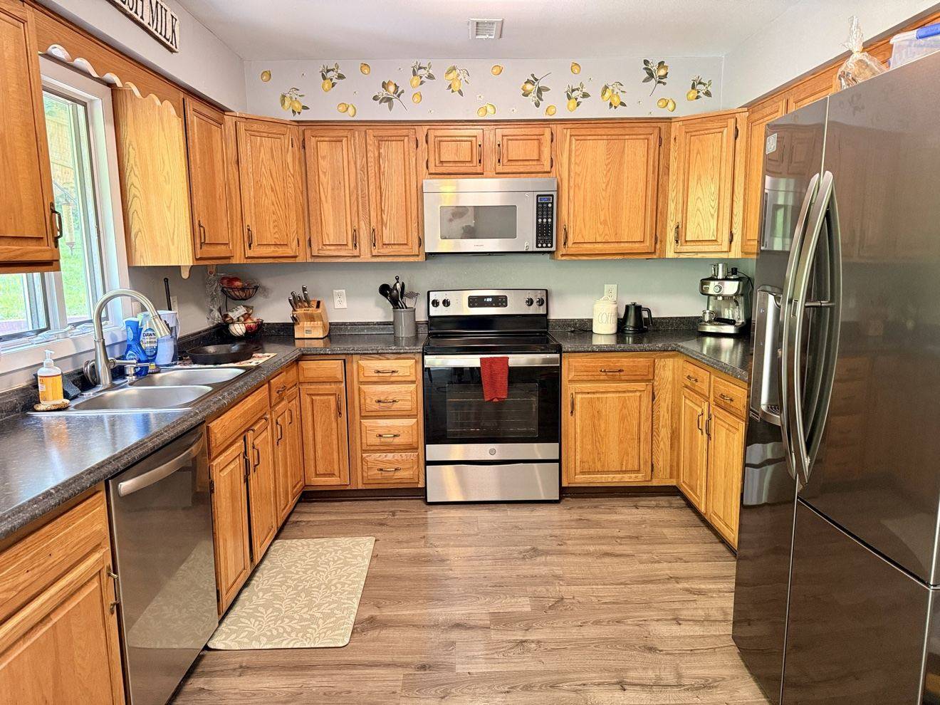 Freshly cleaned kitchen with wood cabinetry