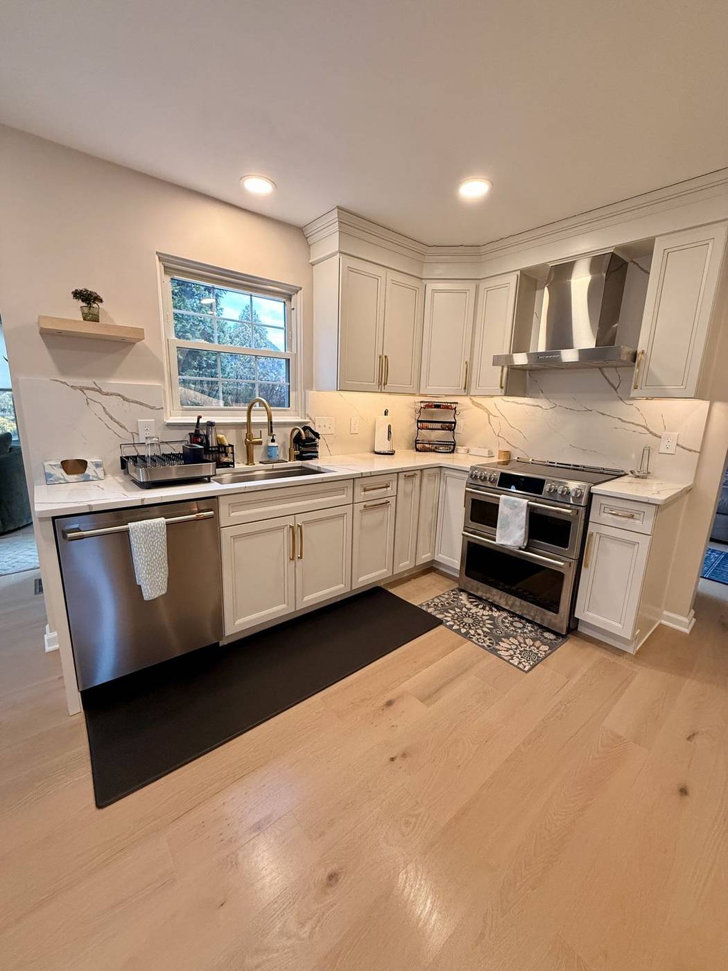White kitchen with a spotless range and counters