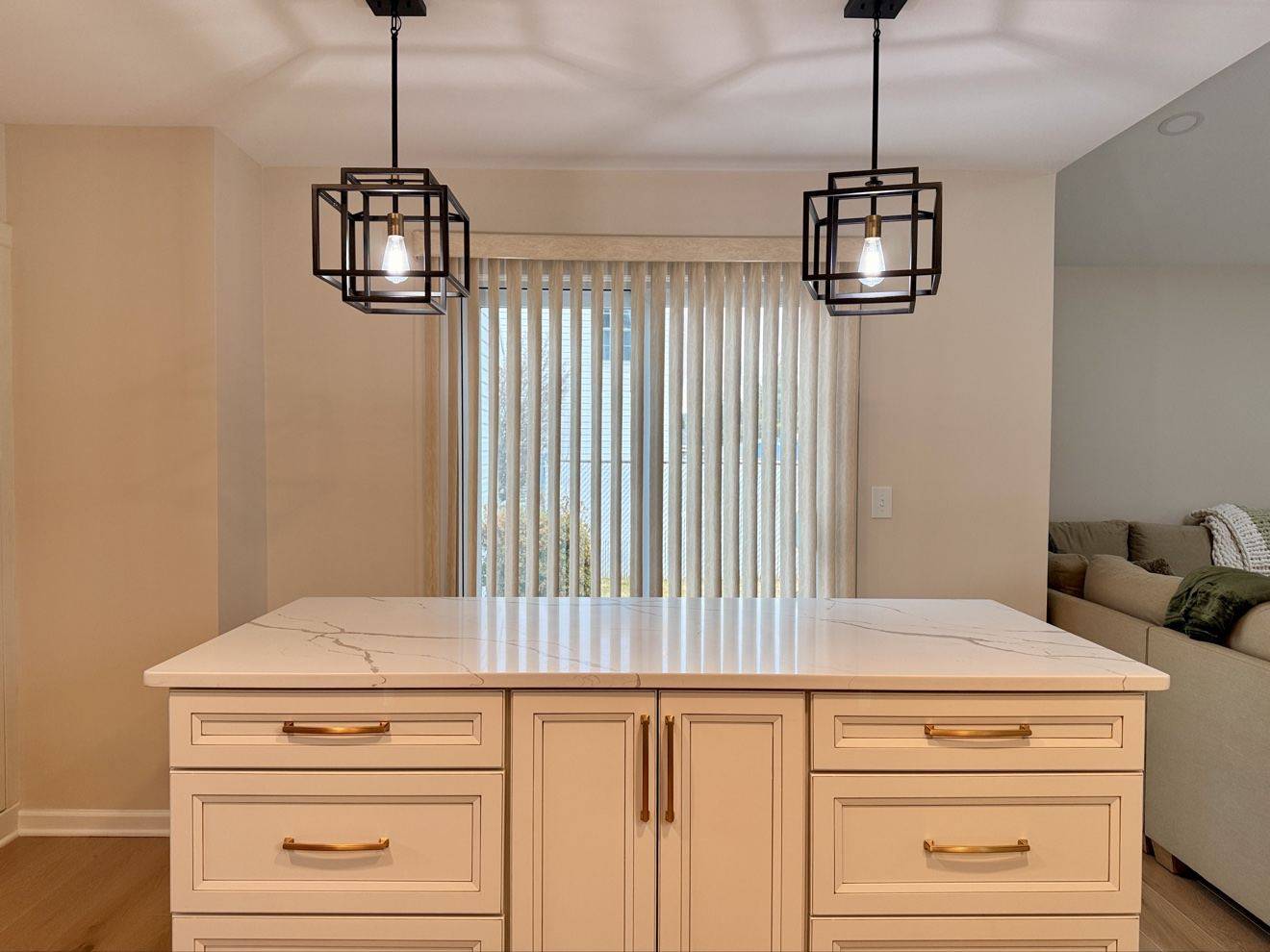 Clean white kitchen island with freshly polished surfaces