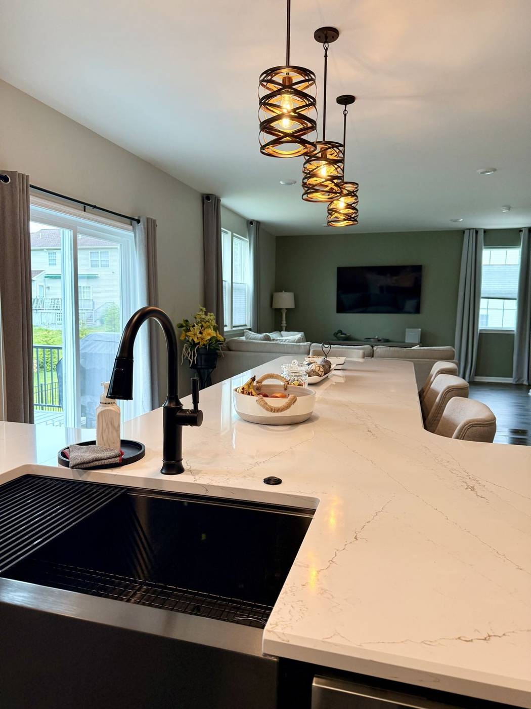 Polished kitchen island with a black faucet