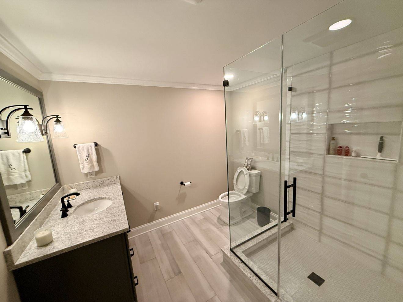 Bright bathroom with a spotless glass shower enclosure