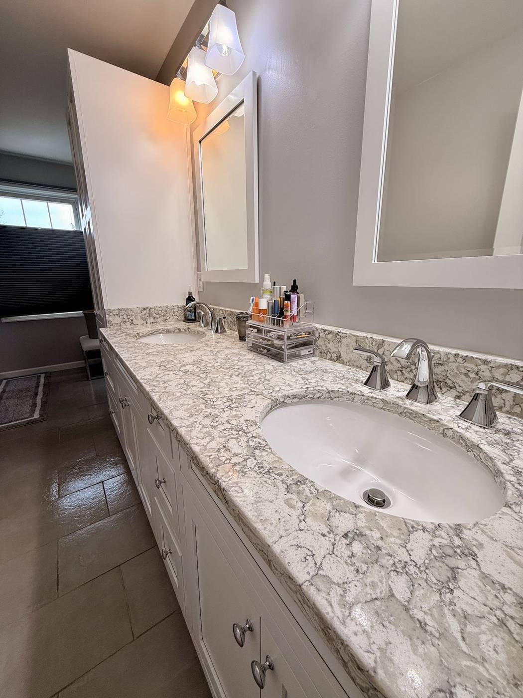 Clean marble bathroom vanity and mirror