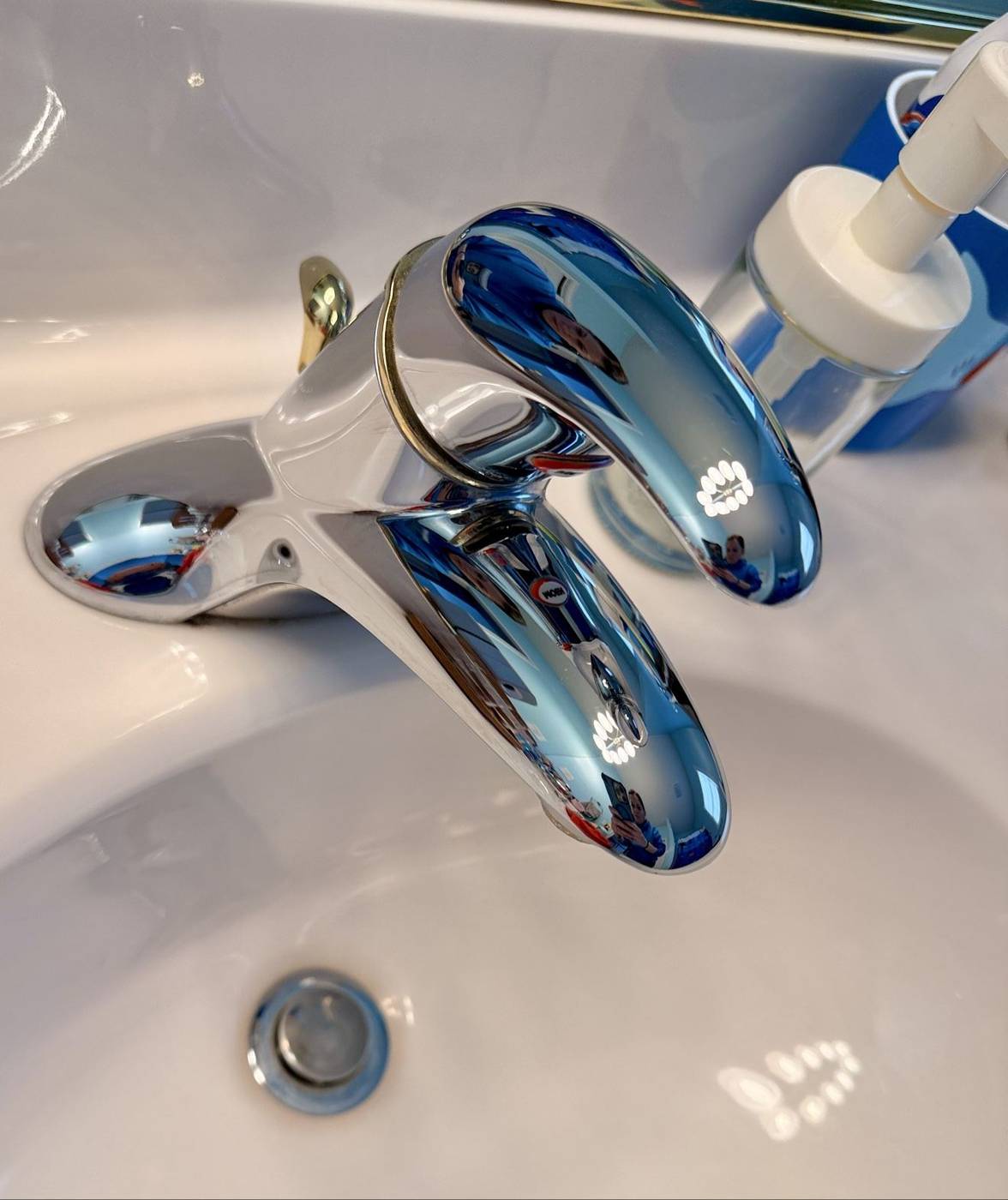Close-up of a polished chrome bathroom faucet