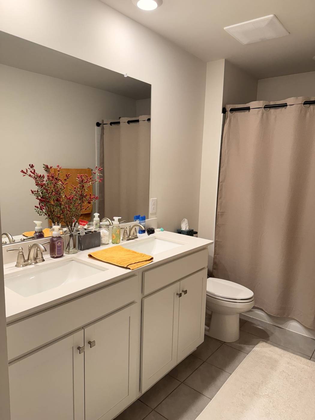 Clean double bathroom vanity and wide mirror