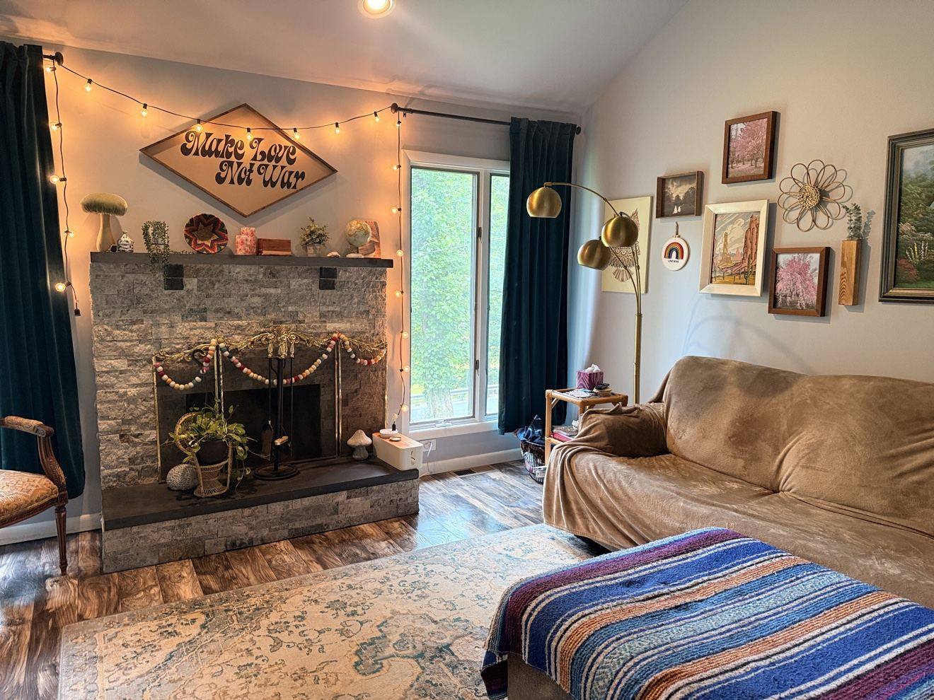 Tidy living room with a stone fireplace
