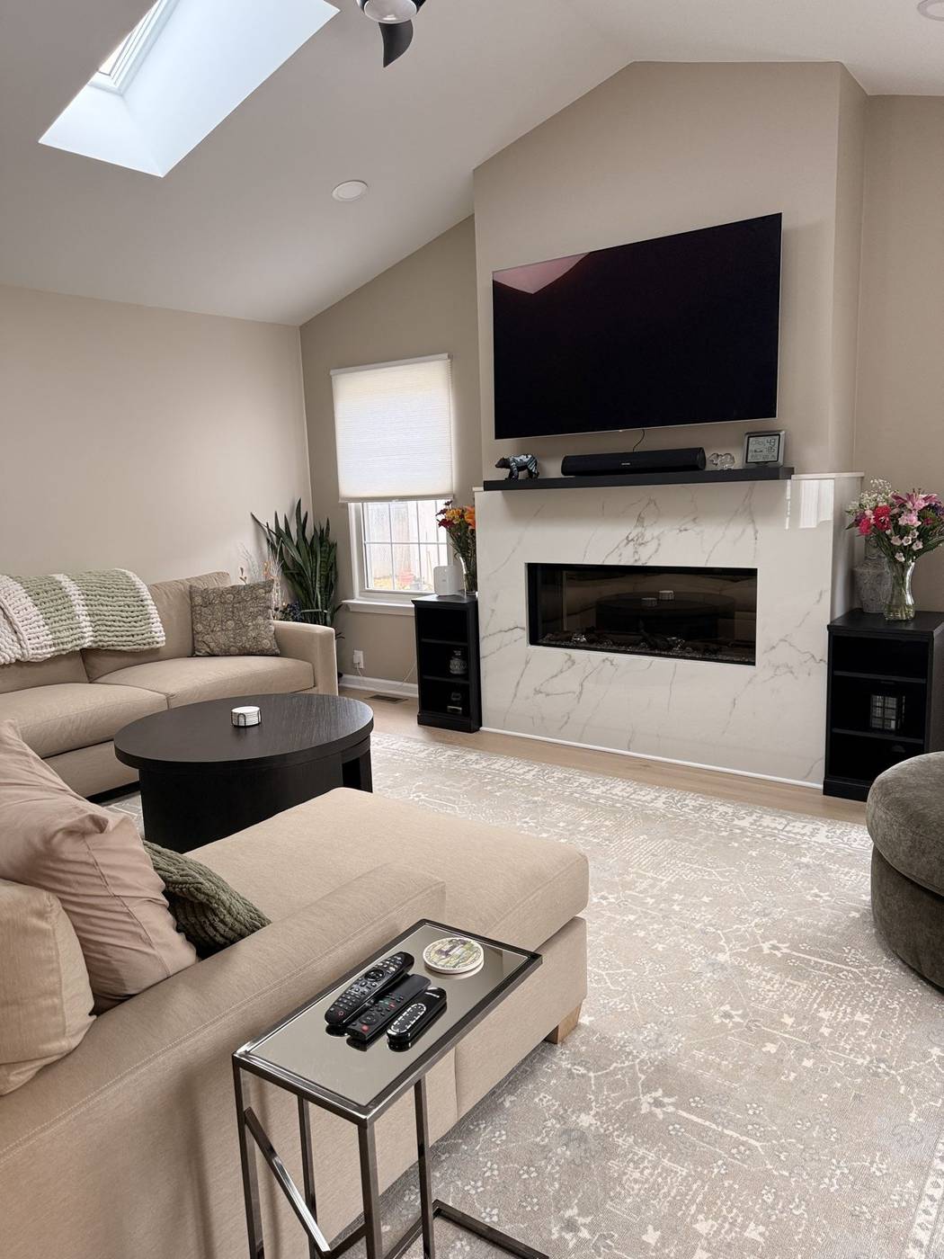 Clean contemporary living room with a fireplace