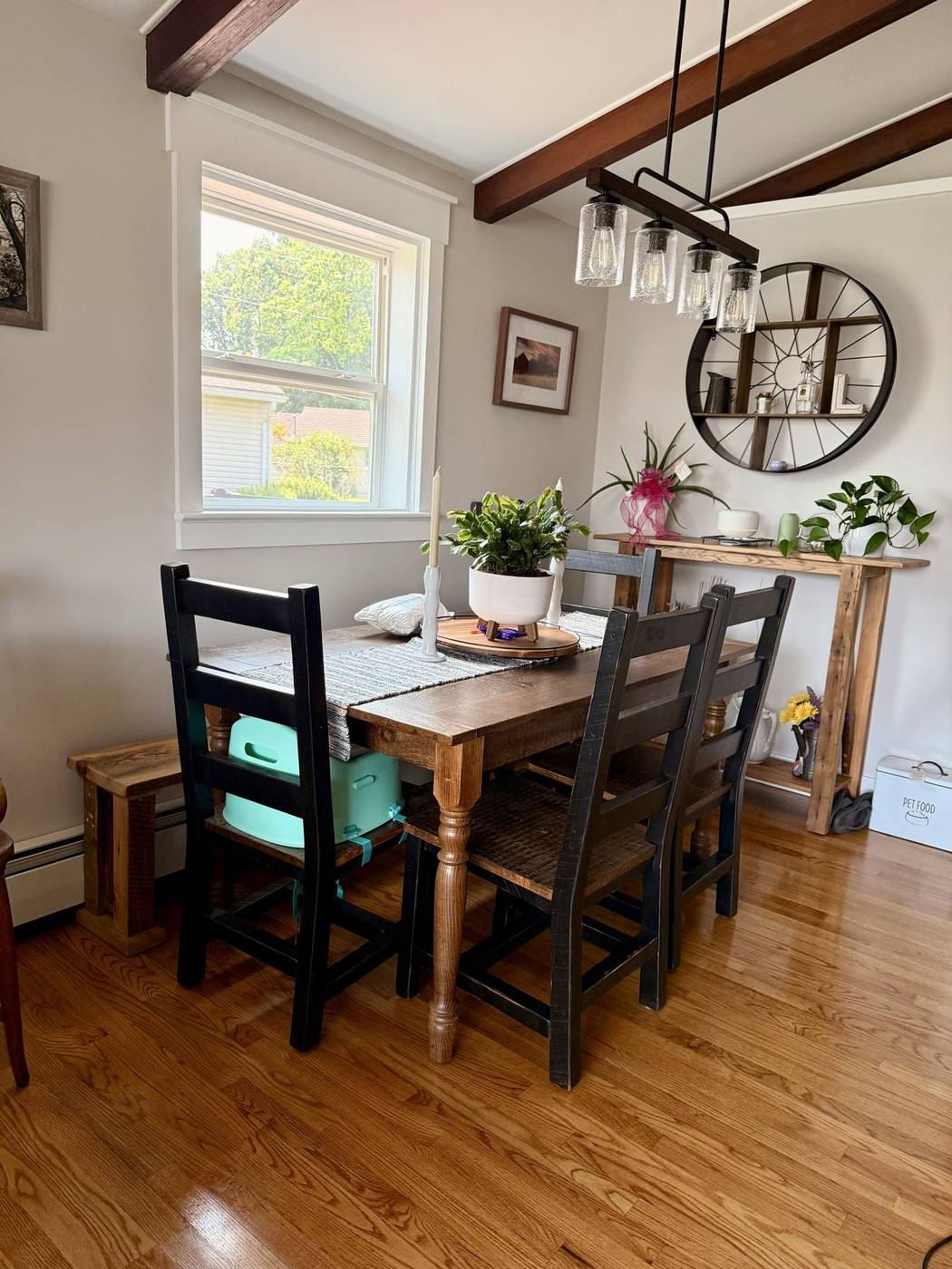 Clean farmhouse dining room with a wood table